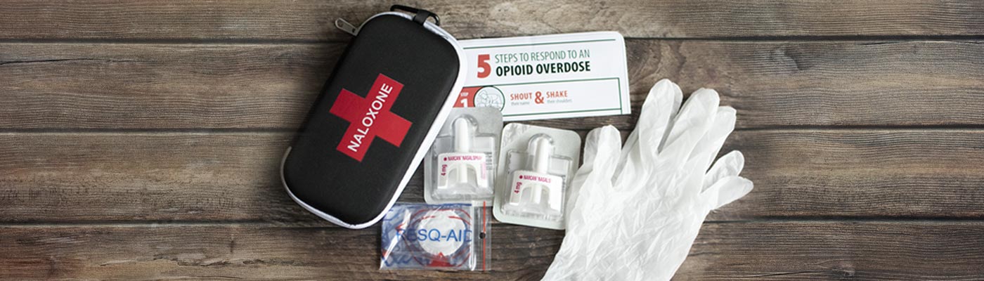 Naloxone kit with instruction sheet, gloves, medicine