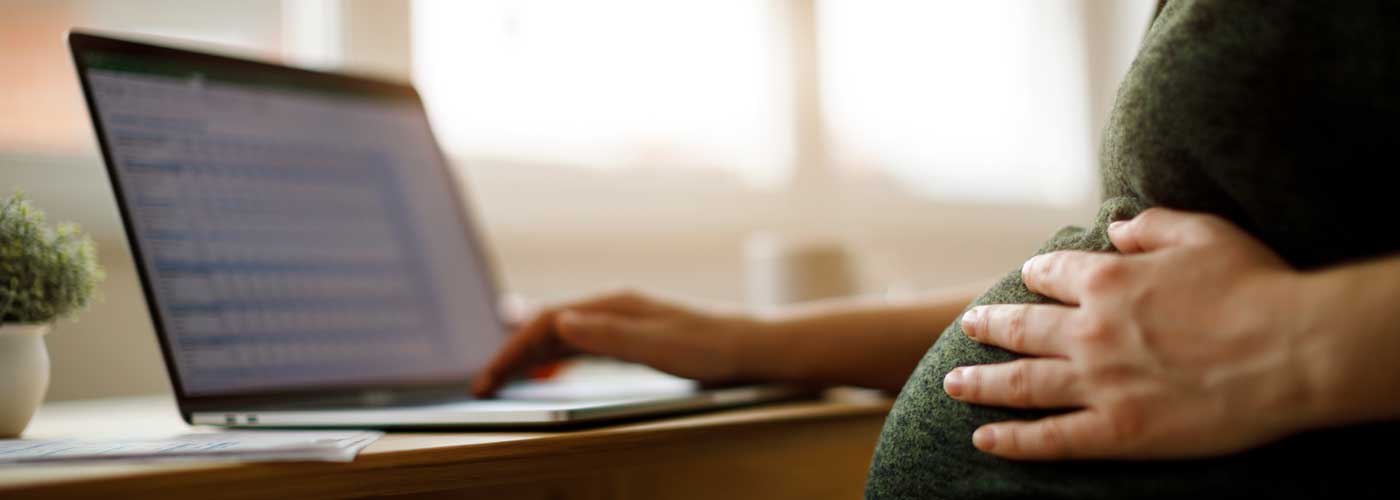 Pregnant person using a computer