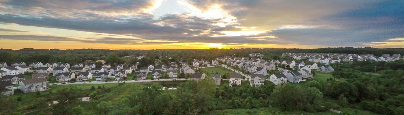 Sky, houses, and grass