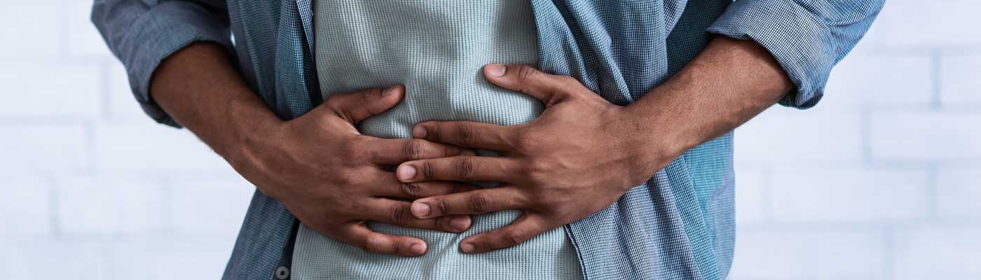 Person holding their stomach with both hands