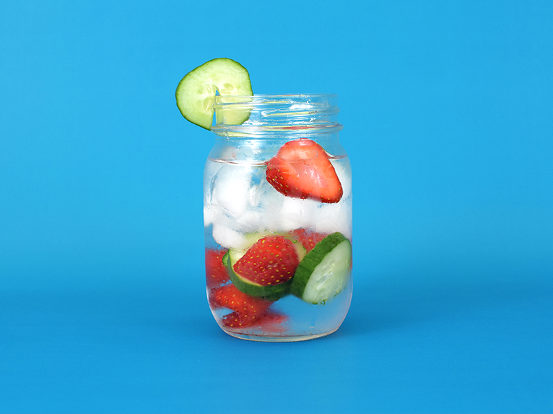 Jar of water with strawberries and cucumber slices