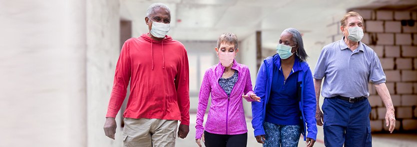 Adults walking indoors