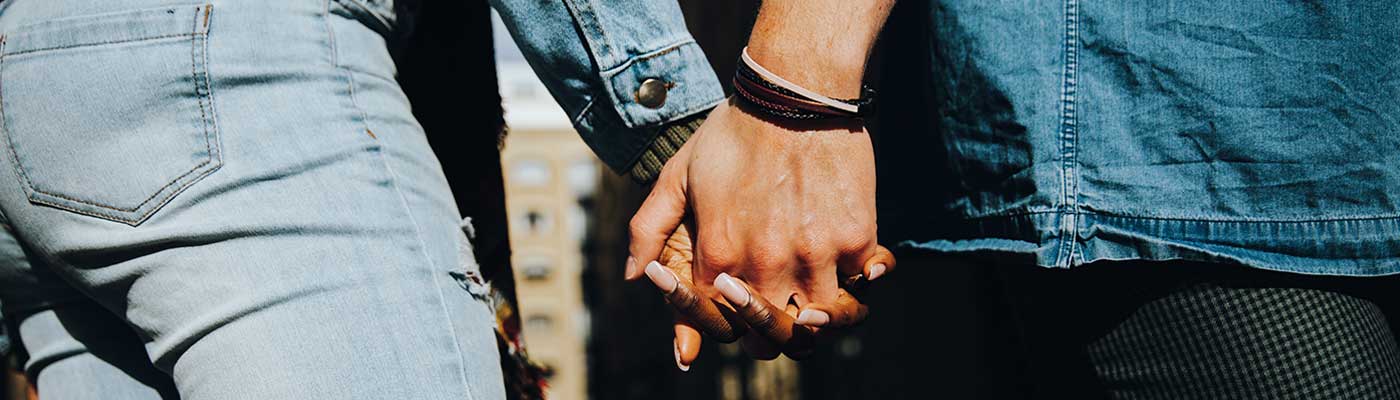 Two people holding hands.