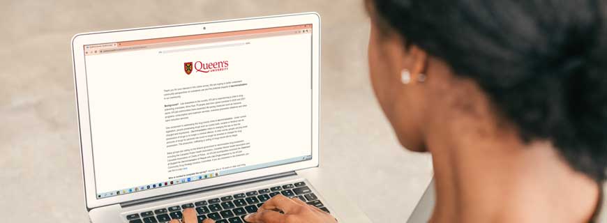 Person looking at a webpage with the Queen's University logo