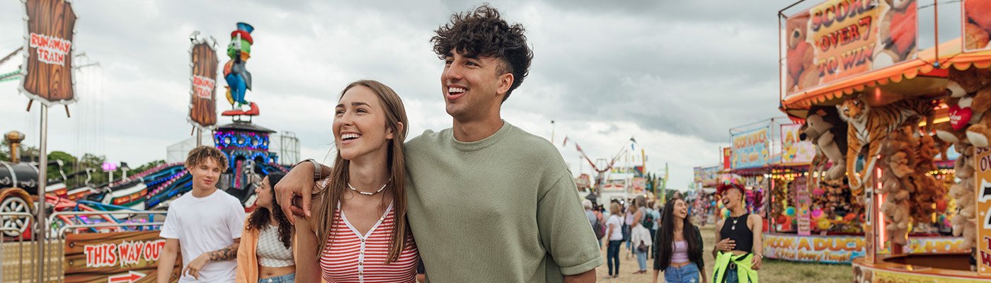 people walking at a fair